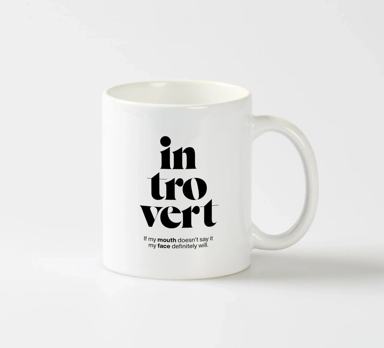 introvert: If my mouth doesn’t say it my face will ceramic mug by The True Type