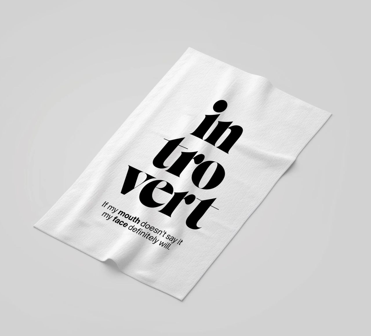 introvert: If my mouth doesn’t say it my face will beach towel by The True Type