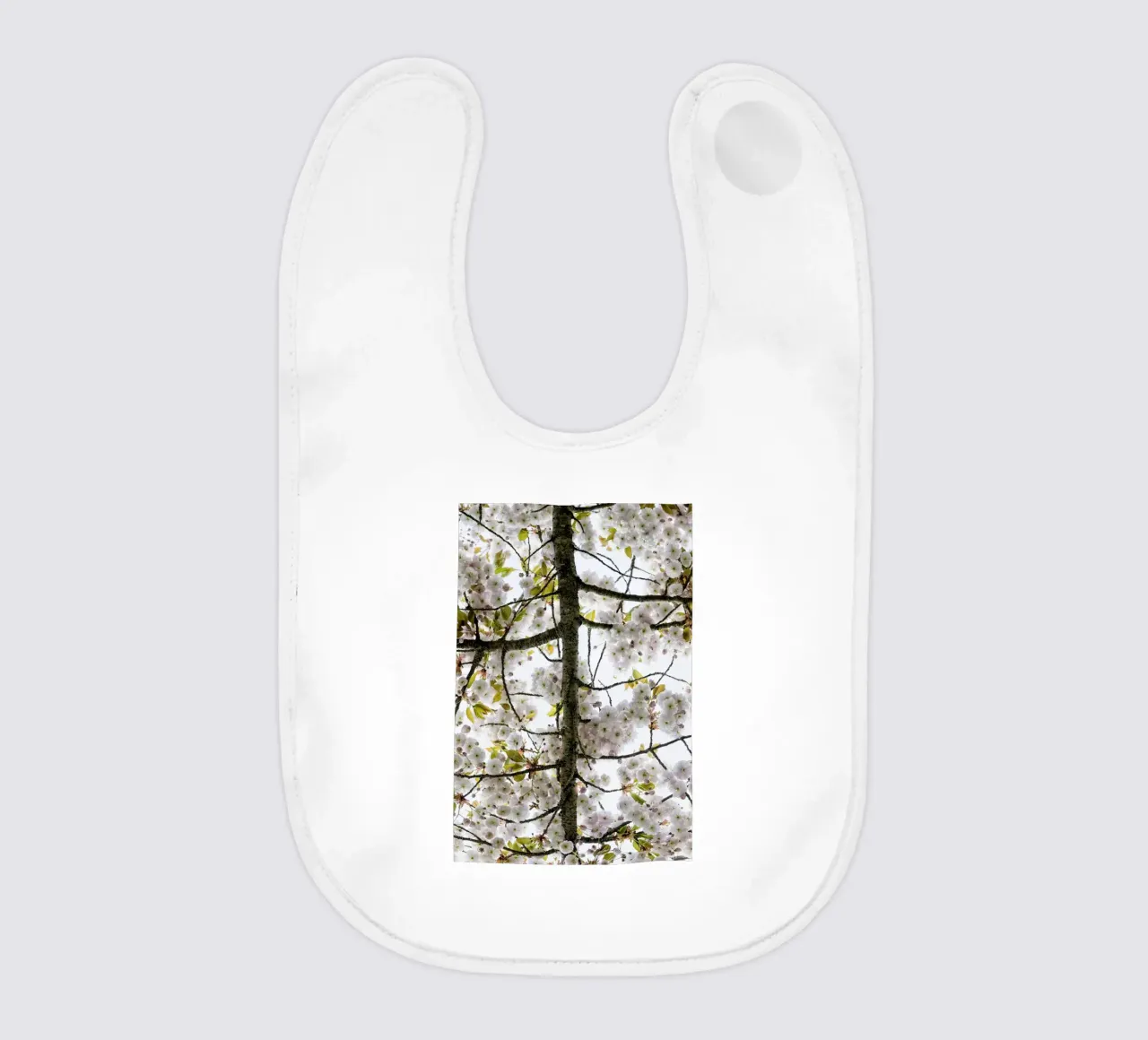 Underneath a Blossoming Tree babero de Curious Collections by Marielle Leenders
