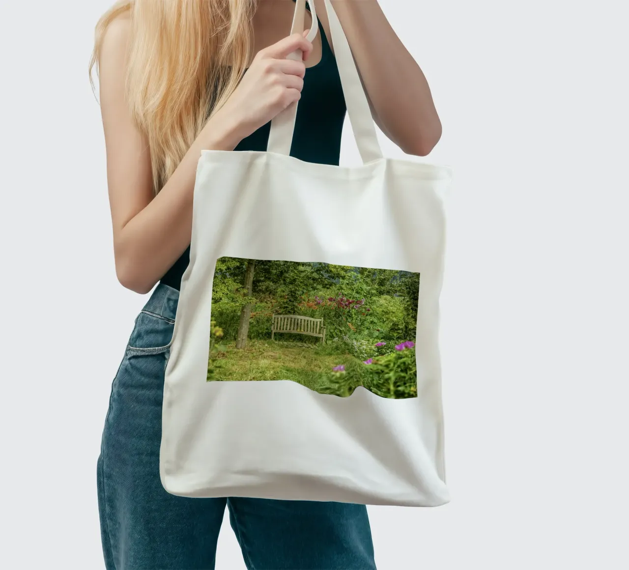 Bench nestled within a vibrant flower garden borsa in juta da Curious Collections by Marielle Leenders
