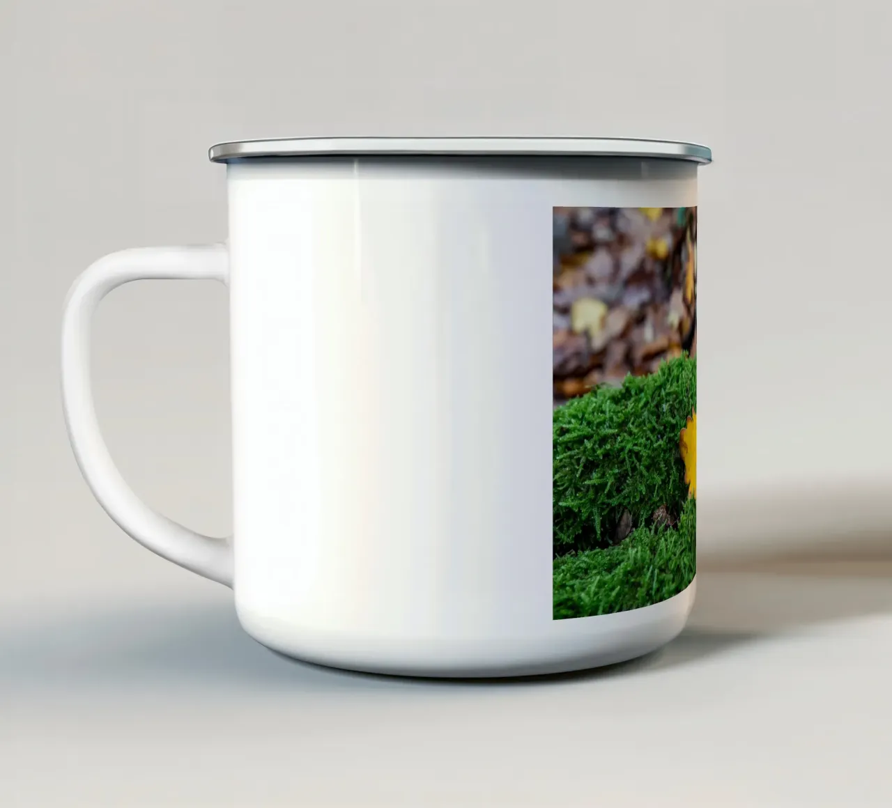 Yellow leaf on green moss enamel mug by anderm