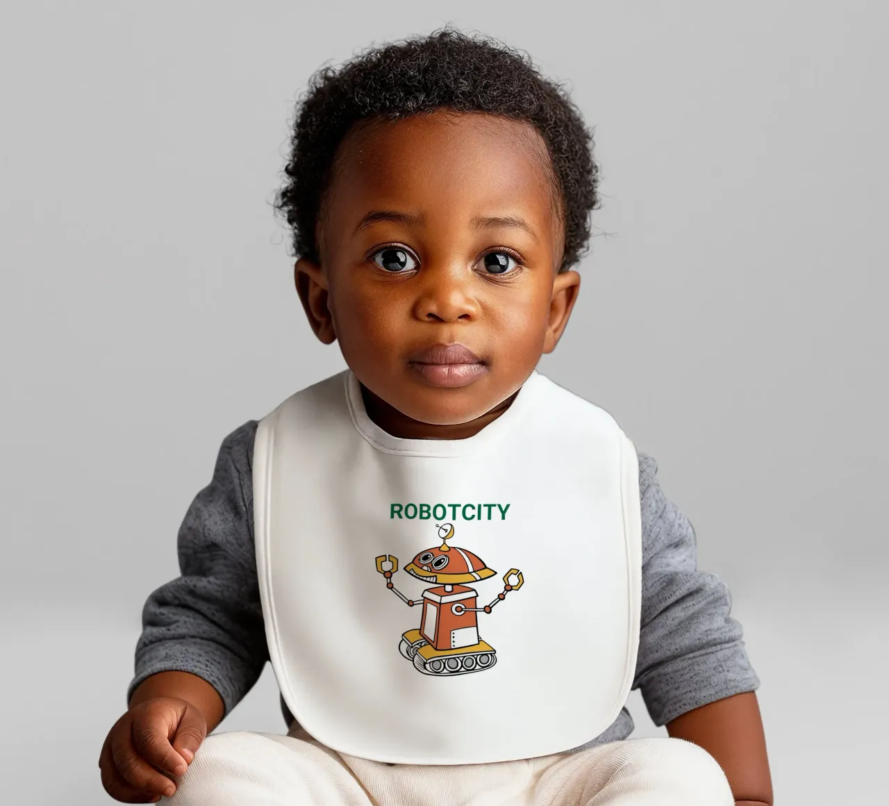 Logo RobotCity: Robot futuristico a cartoni animati bavaglino da ComfyCouture