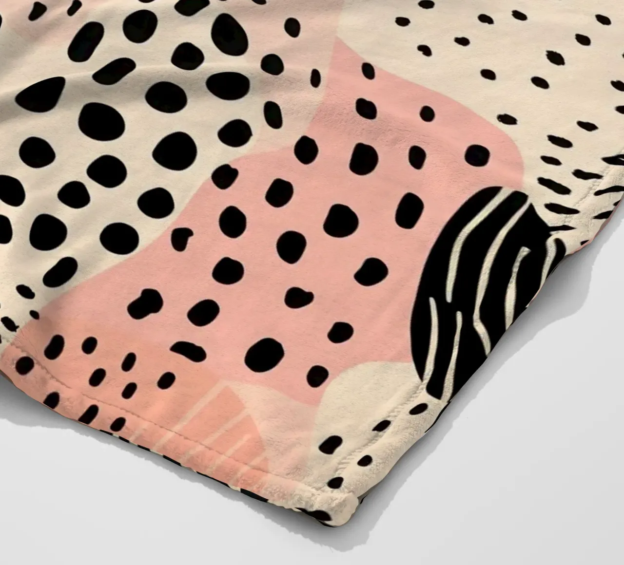 Decorative pattern in dusky pink and black fleece blanket by Autofocus