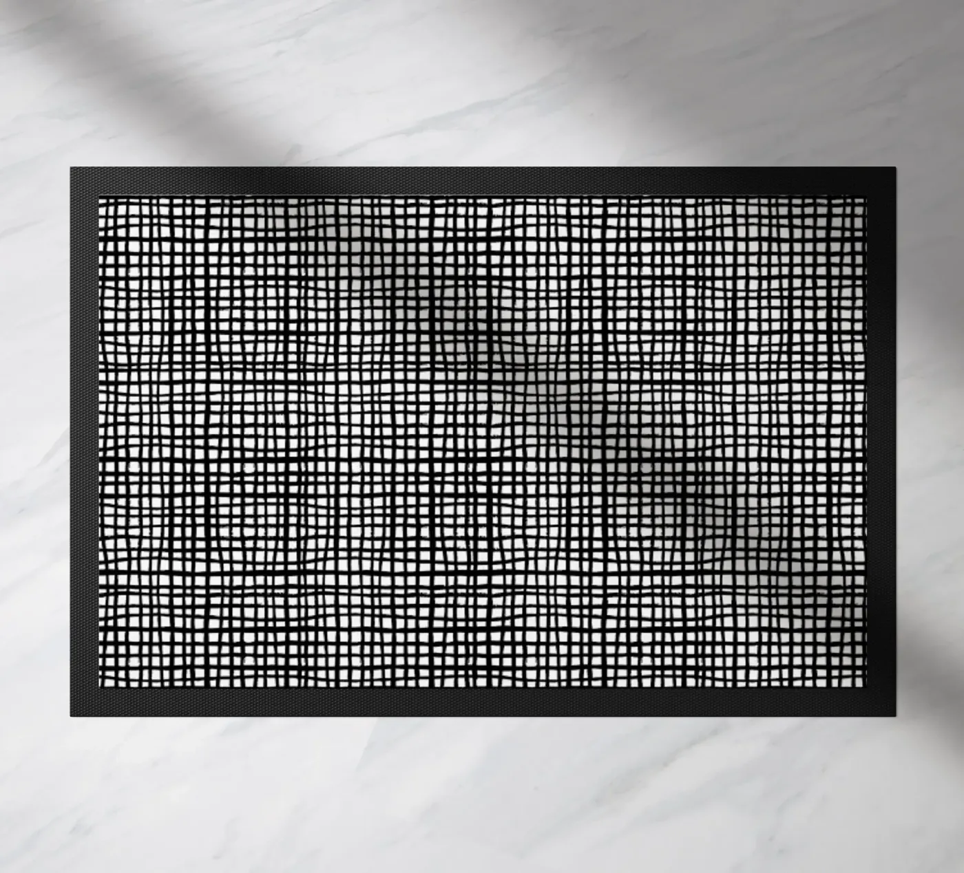 Grid doormat by Charlotte Winter