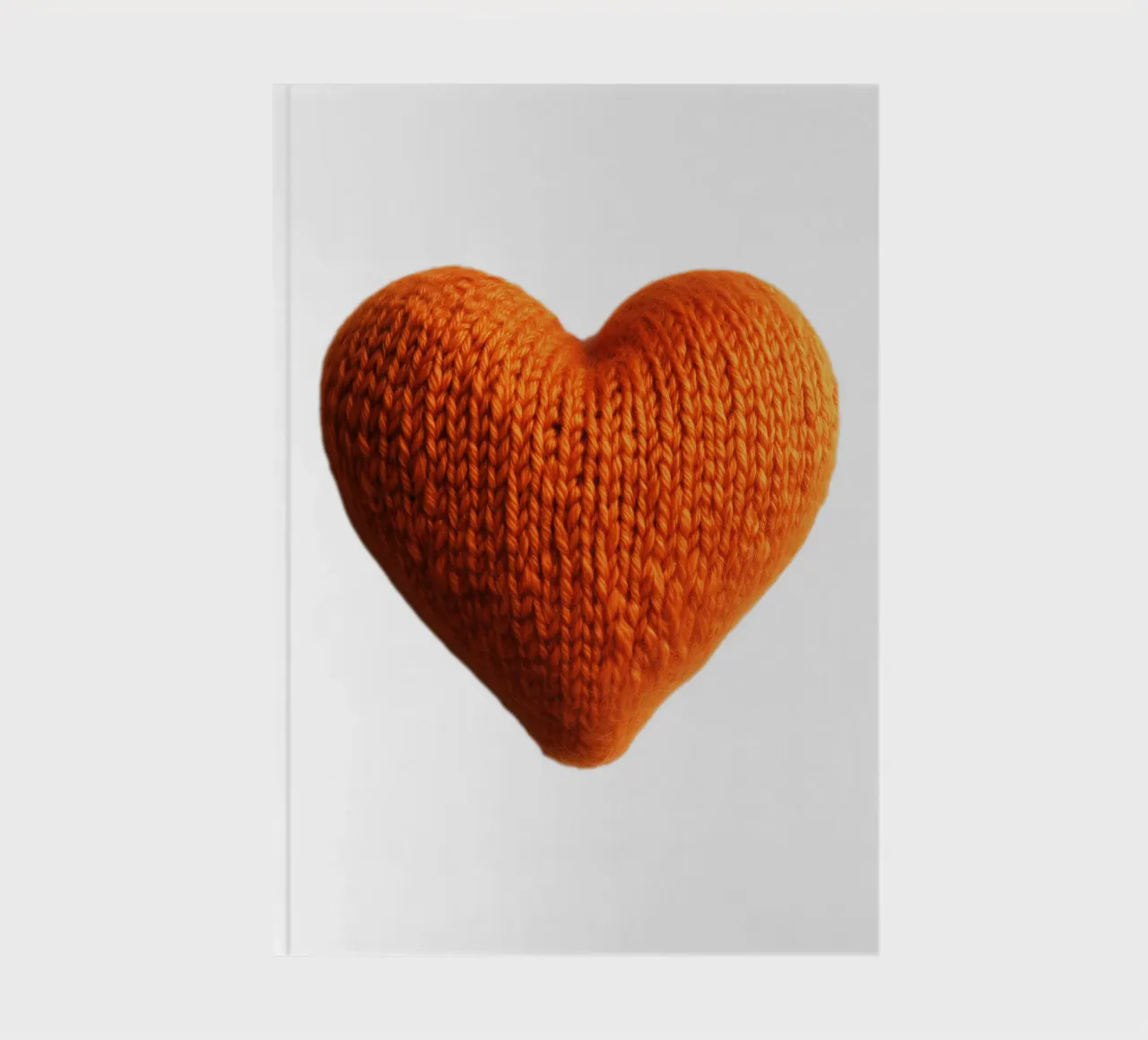 Cuore riscaldante a maglia arancione diario da Autofocus