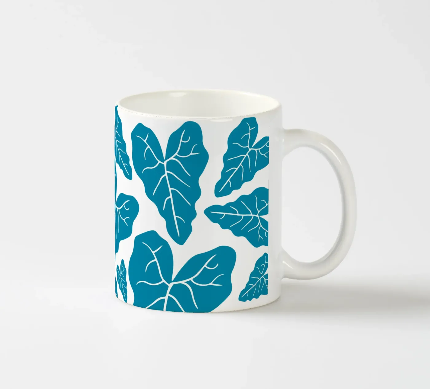 Blue leaves pattern ceramic mug by baobabprintstore