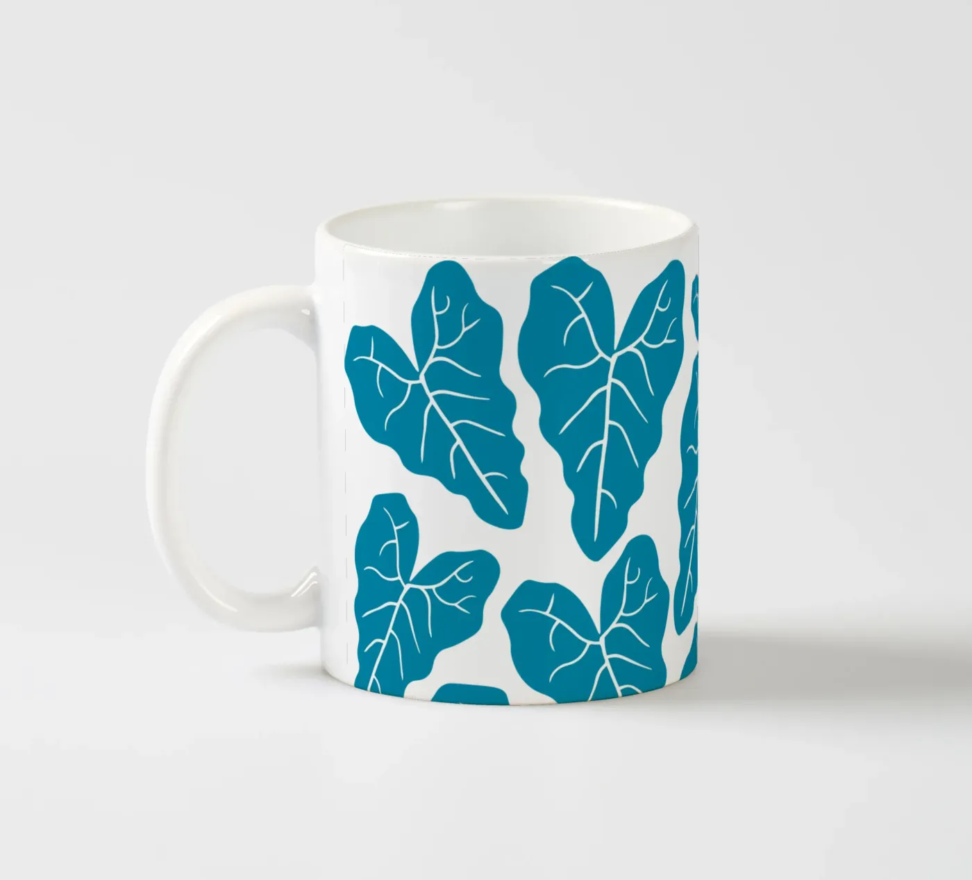 Blue leaves pattern ceramic mug by baobabprintstore