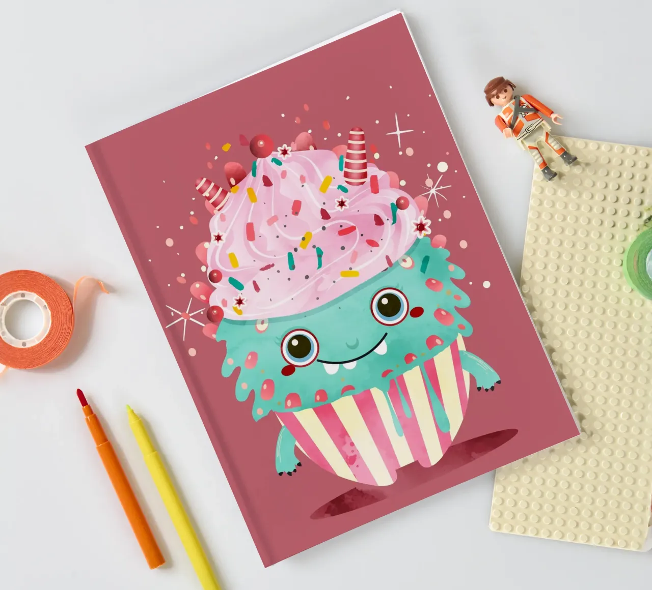 Cupcake monster motif with colourful icing & sprinkles notebook by namosh
