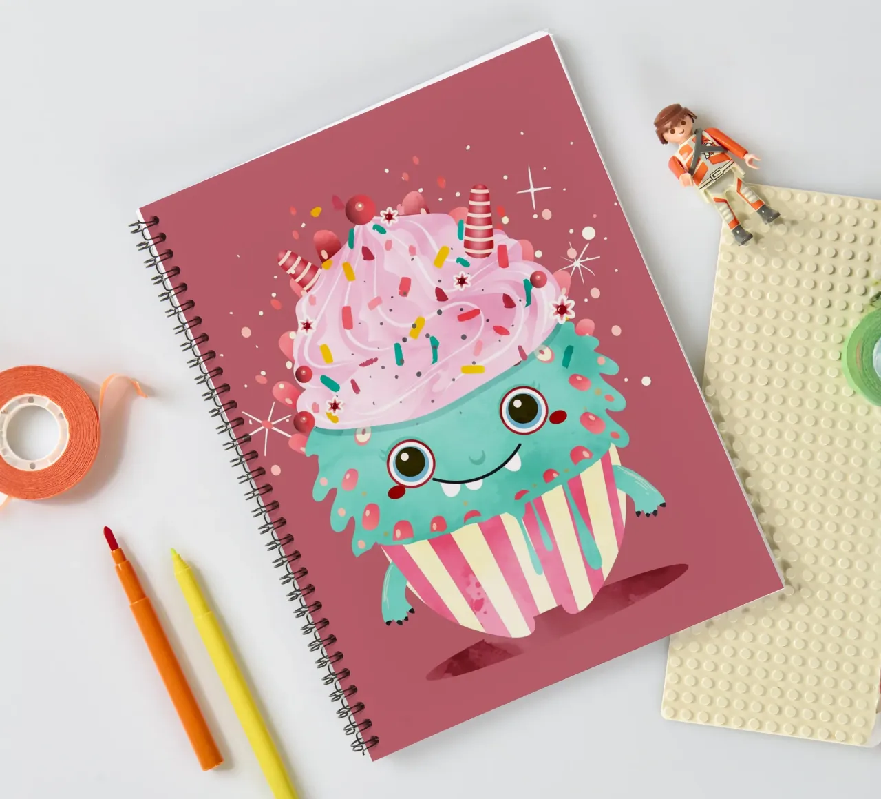 Cupcake monster motif with colourful icing & sprinkles spiral notebook by namosh