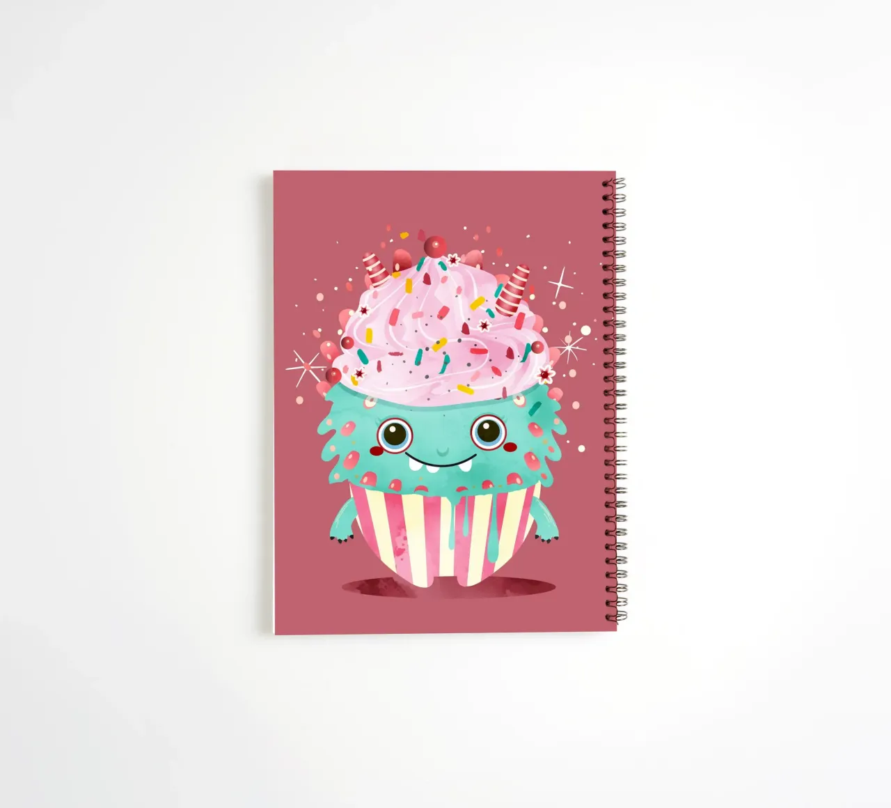 Cupcake monster motif with colourful icing & sprinkles spiral notebook by namosh