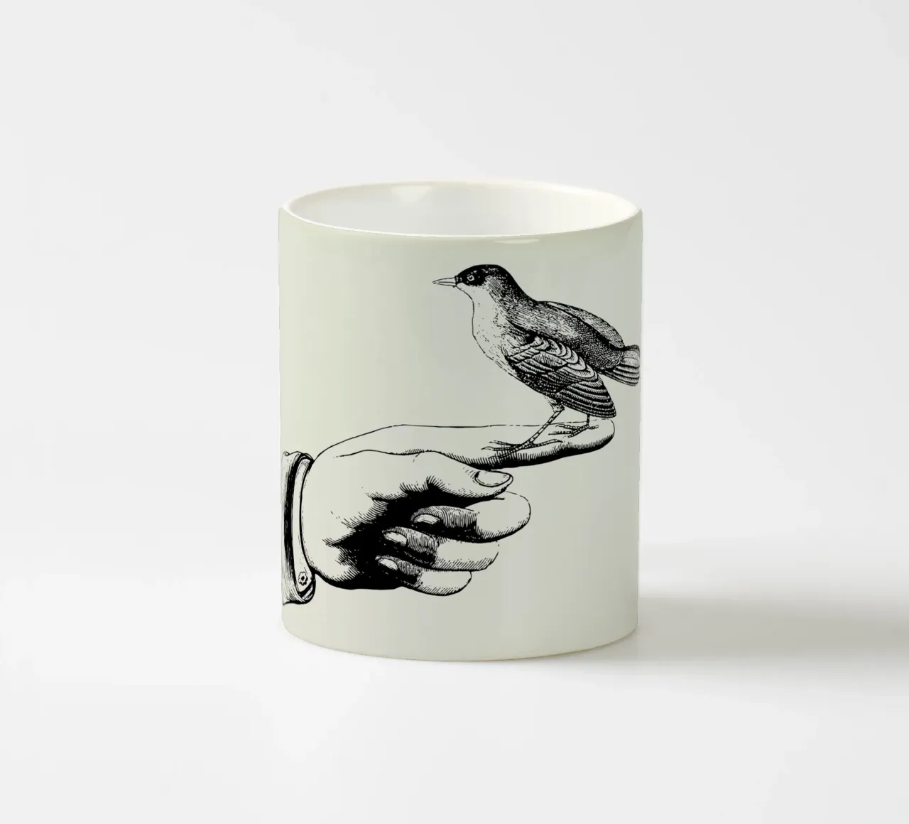 Bird in the hand ceramic mug by Jacqueline Maldonado