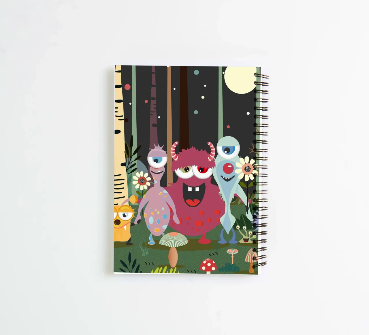 Un groupe de monstres joyeux dans une forêt enchantée carnet à spirale de namosh