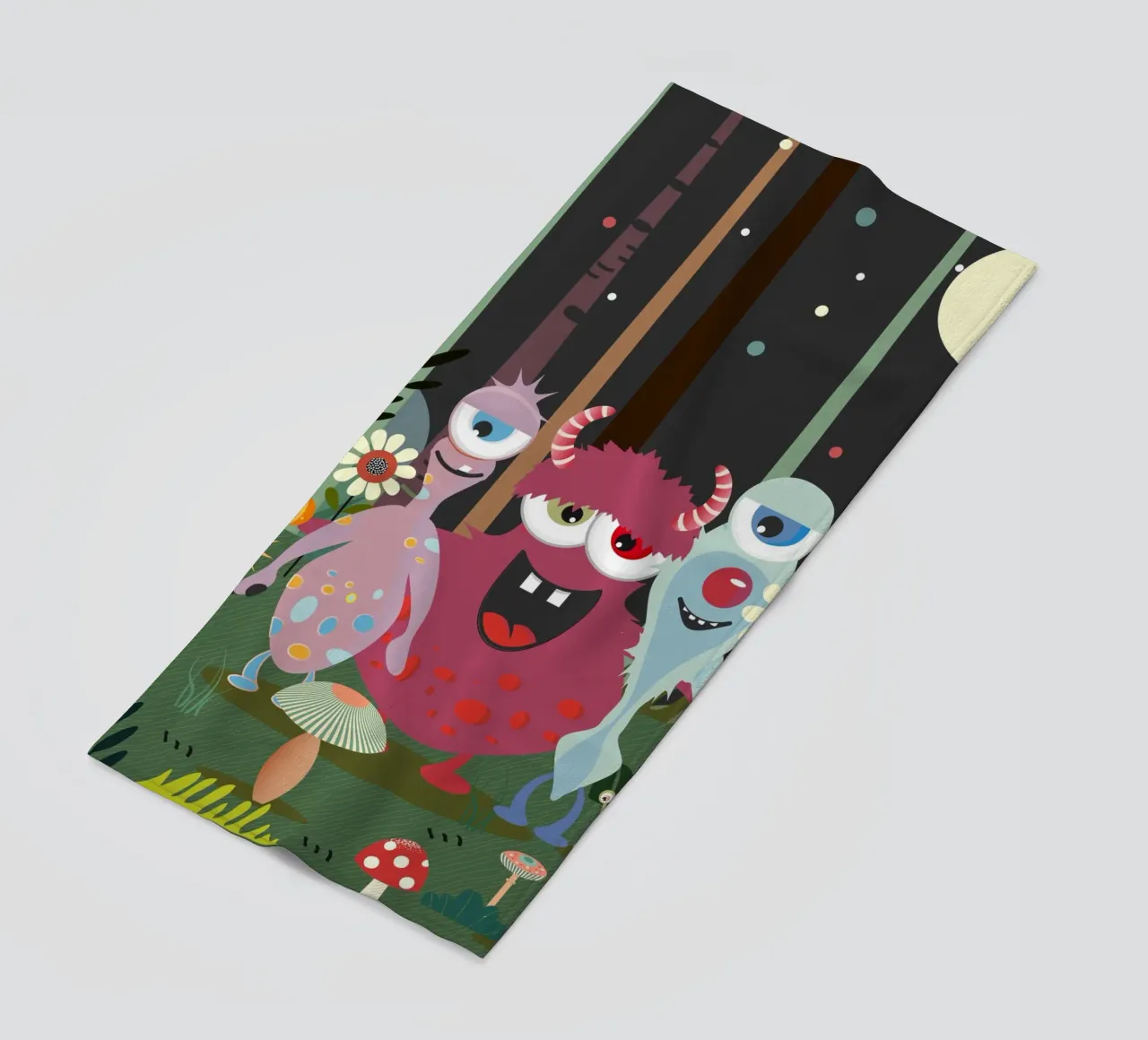 Un groupe de monstres joyeux dans une forêt enchantée serviette de plage de namosh