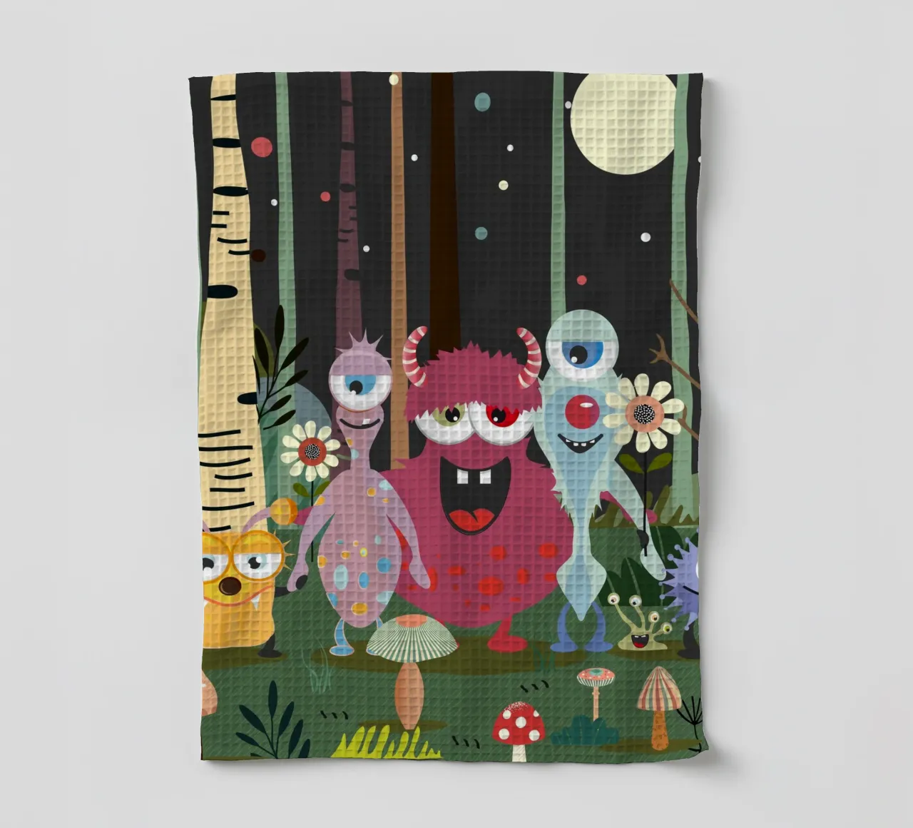 Un groupe de monstres joyeux dans une forêt enchantée torchon de namosh