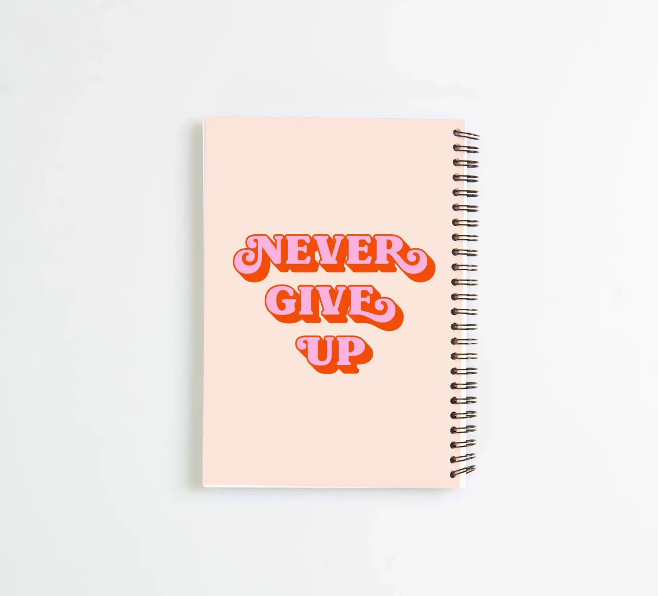 Never give up (Peach tone) spiral notebook by Paigaam Studio