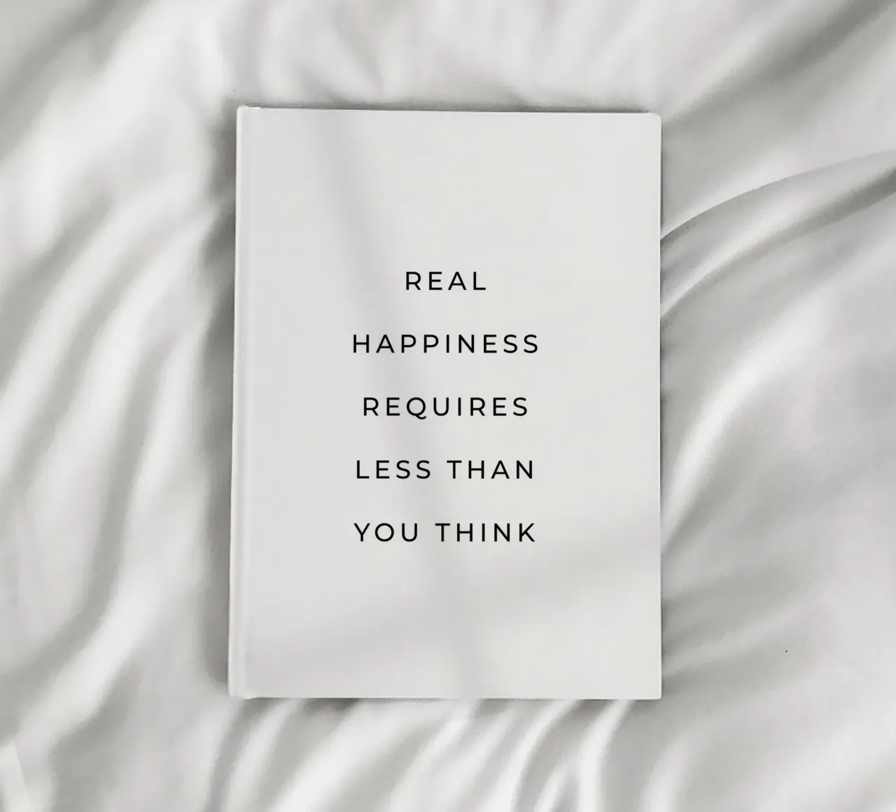 Real happiness requires less than you think quote notebook by Paigaam Studio