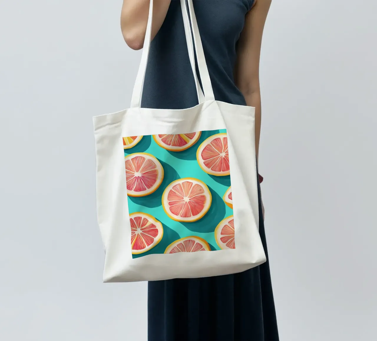 Grapefruit on a turquoise background tote bag by Spice & Style