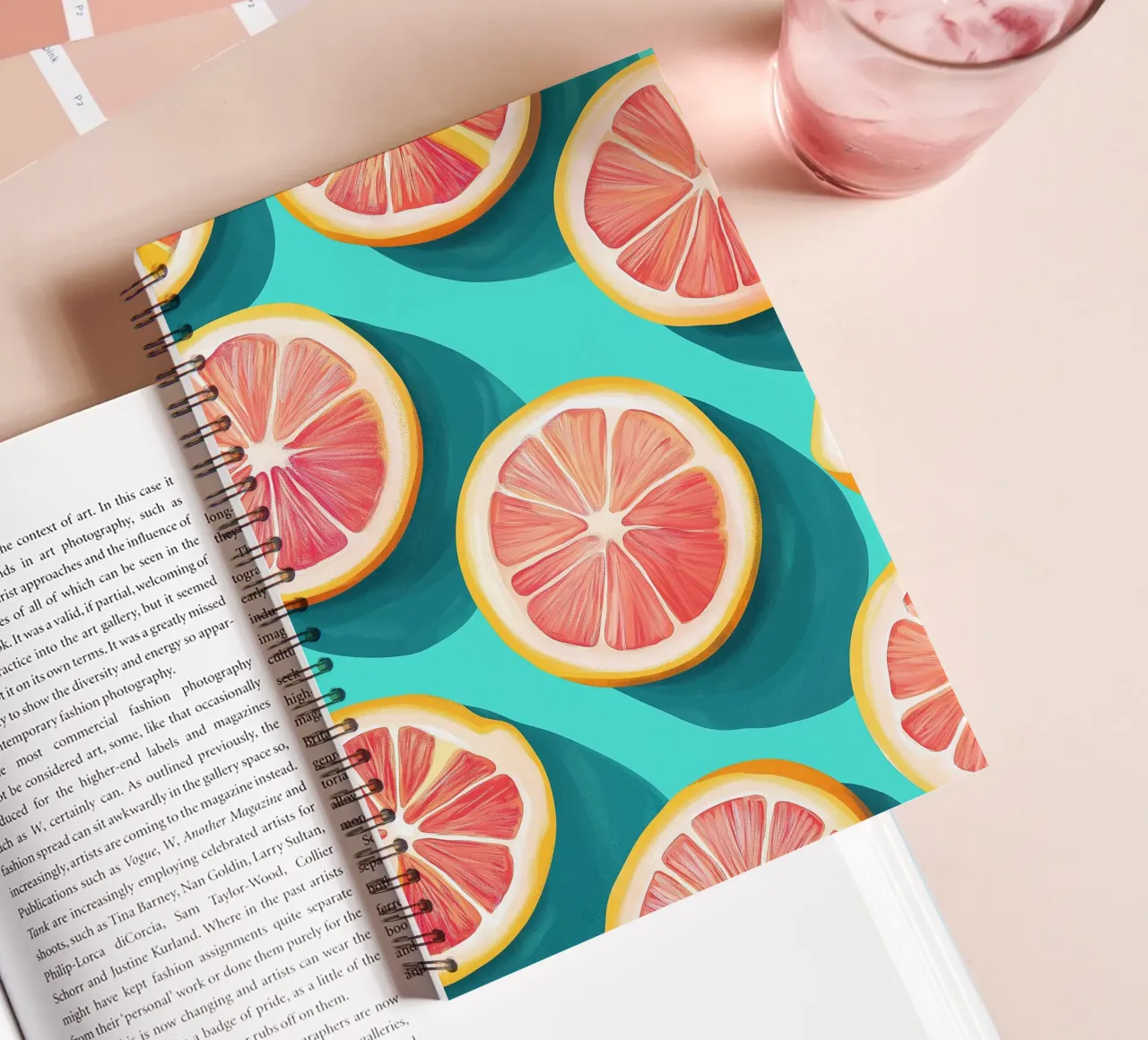 Grapefruit on a turquoise background spiral notebook by Spice & Style