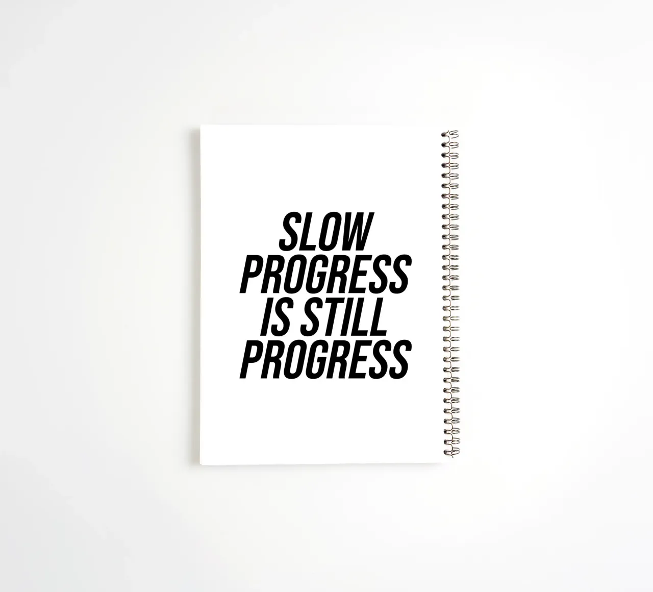Un progreso lento sigue siendo un progreso cuaderno de espiral de Paigaam Studio