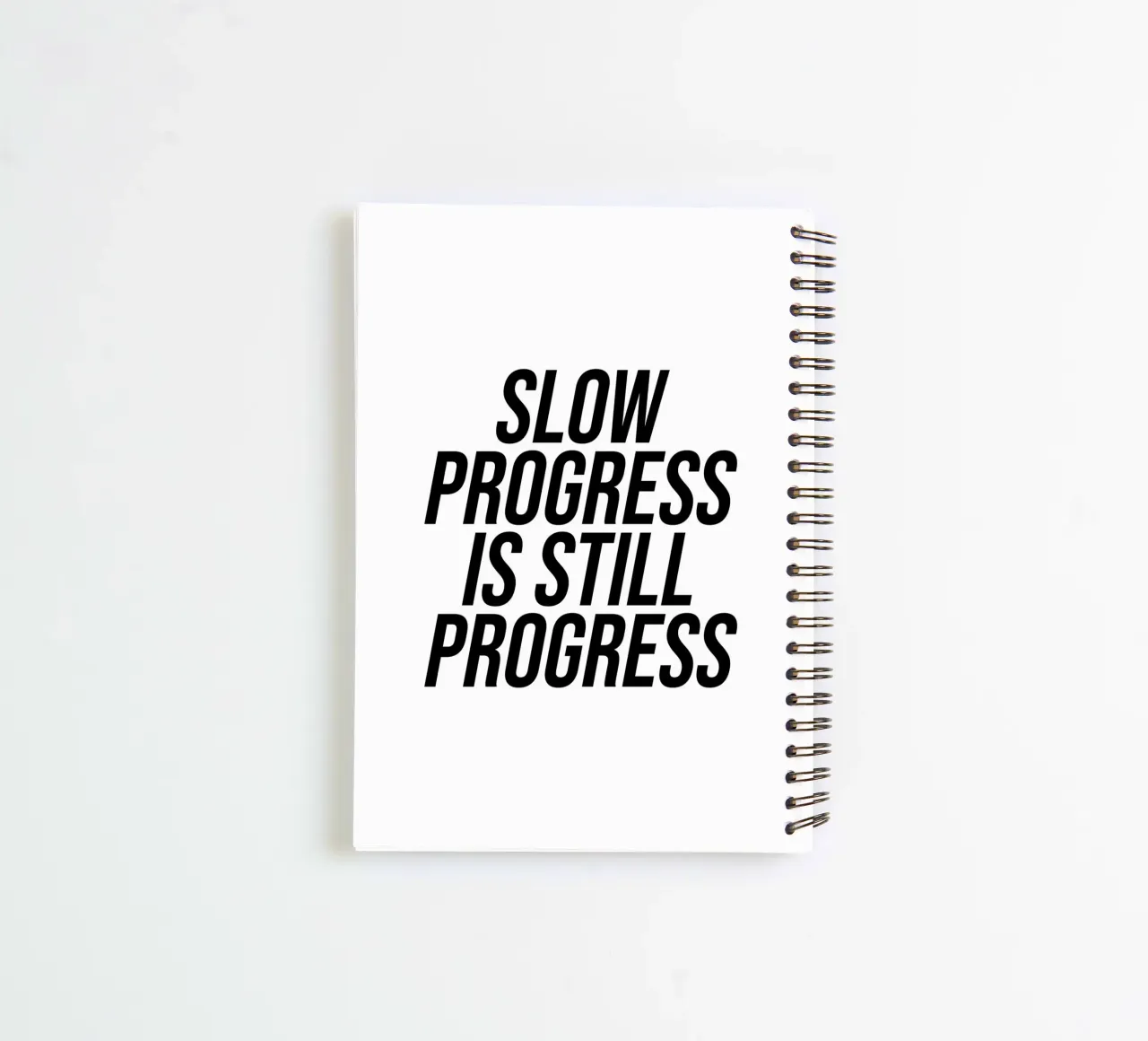 Un progreso lento sigue siendo un progreso cuaderno de espiral de Paigaam Studio