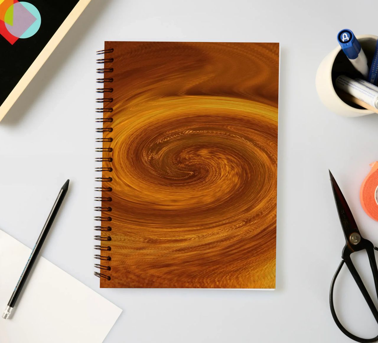 Abstract dynamic twisted pattern in orange and brown spiral notebook by Something for you