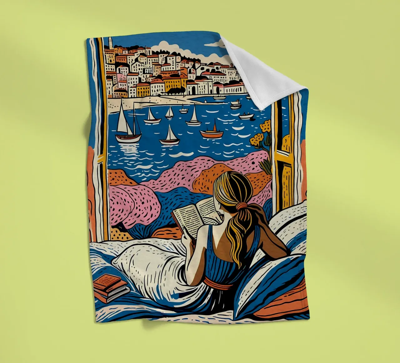 Reader in front of the window in Cannes fleece blanket by Couleursdusud