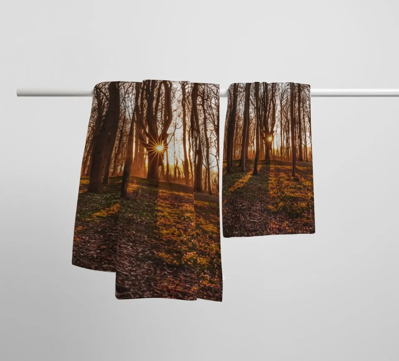 Sun star in the ghostly forest on the Baltic Sea towel by Marcus Beckert | Fotografie