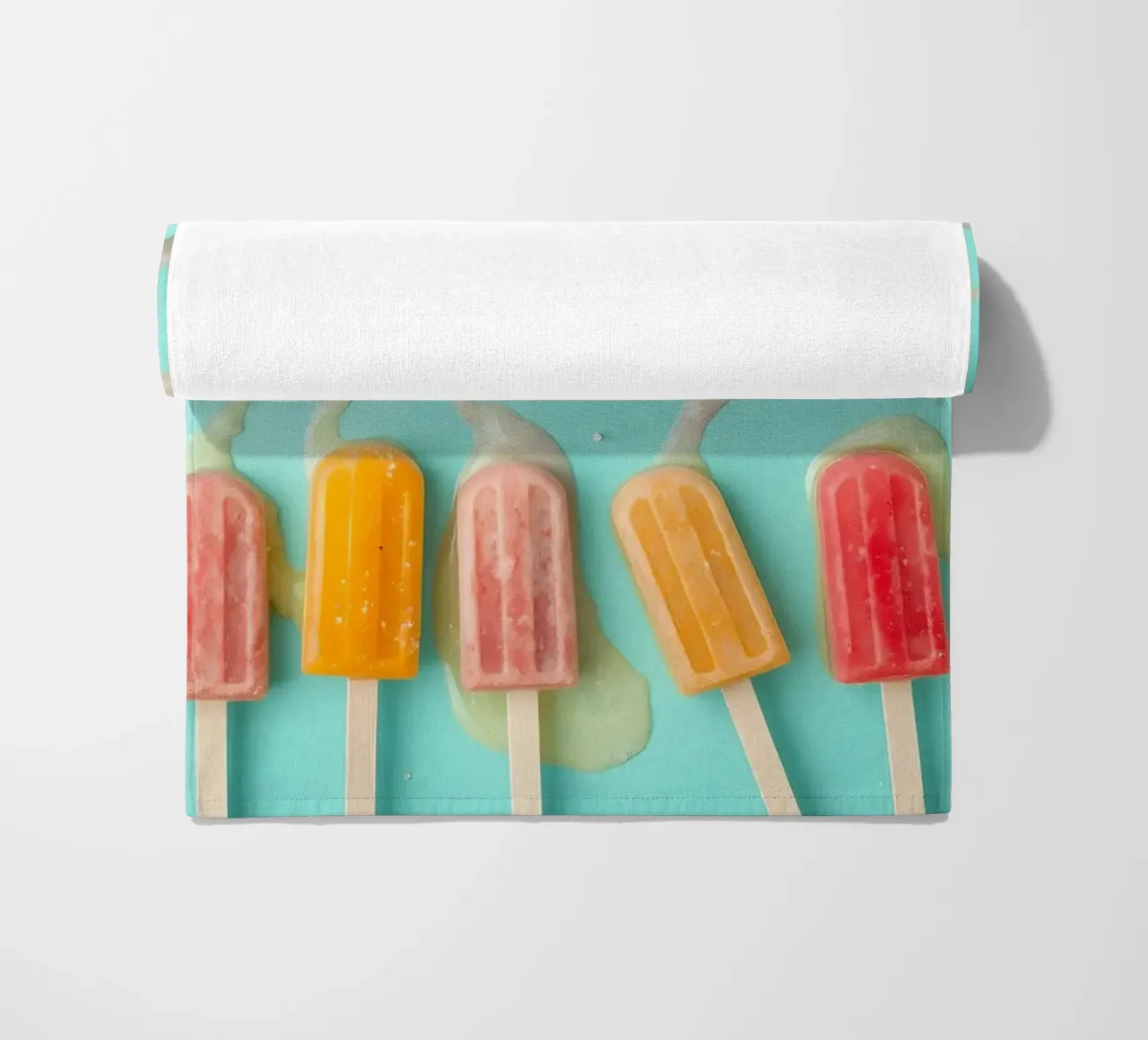 Colorful frozen pops displayed on a blue surface telo mare da DesignDoodle