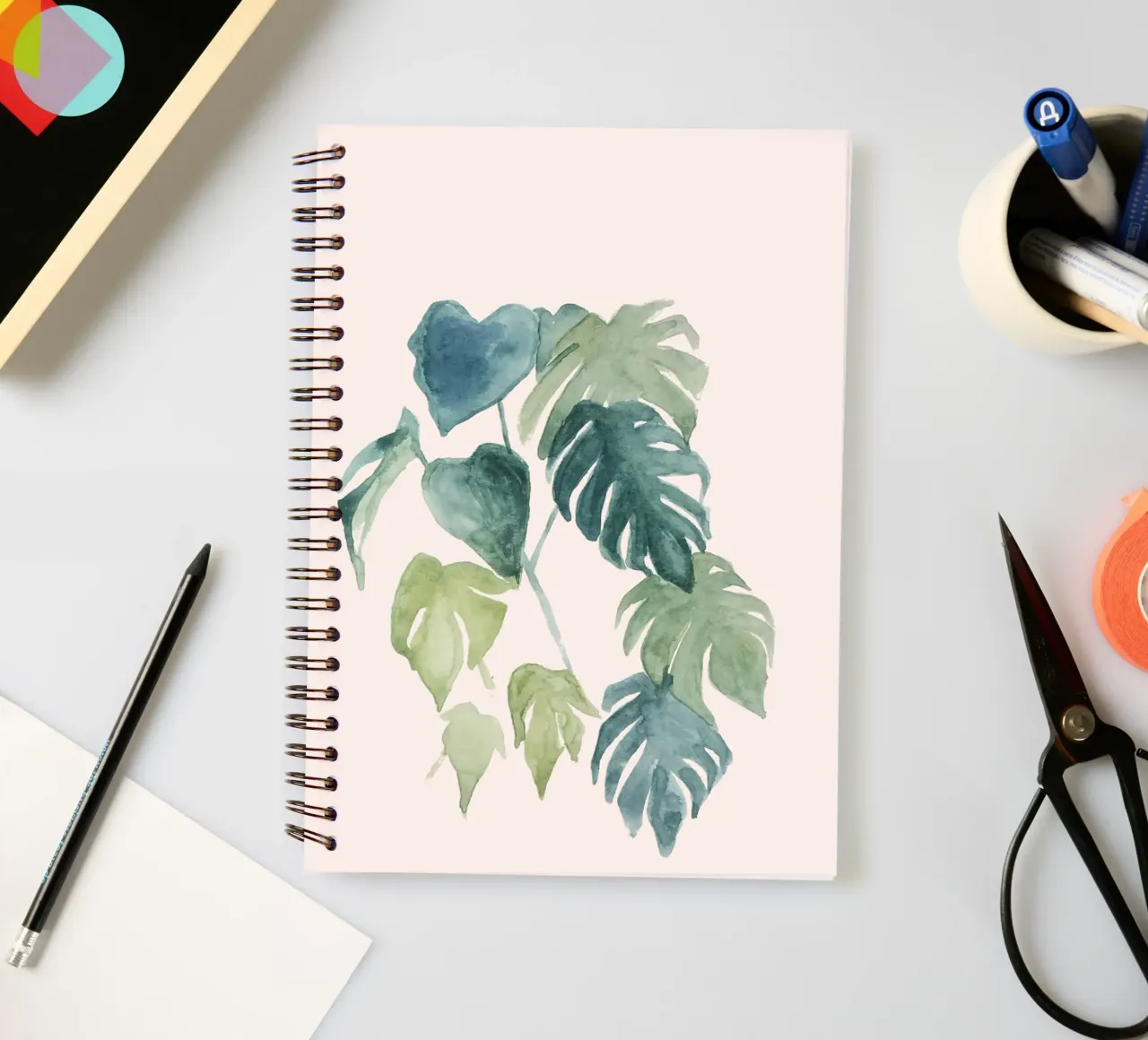 Hand-painted watercolour palm and monstera jungle leaves spiral notebook by Bloomery Decor