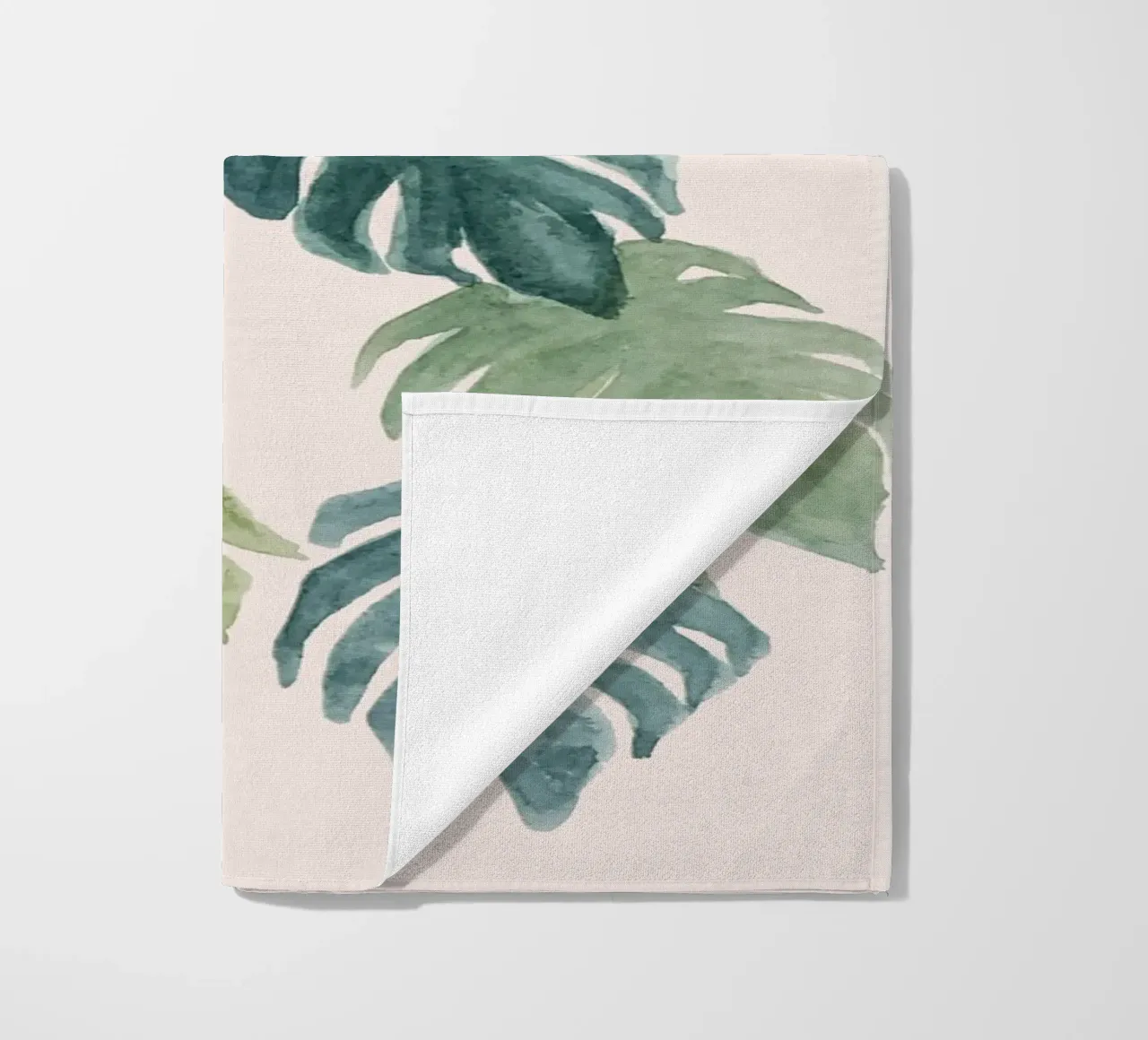 Hand-painted watercolour palm and monstera jungle leaves beach towel by Bloomery Decor