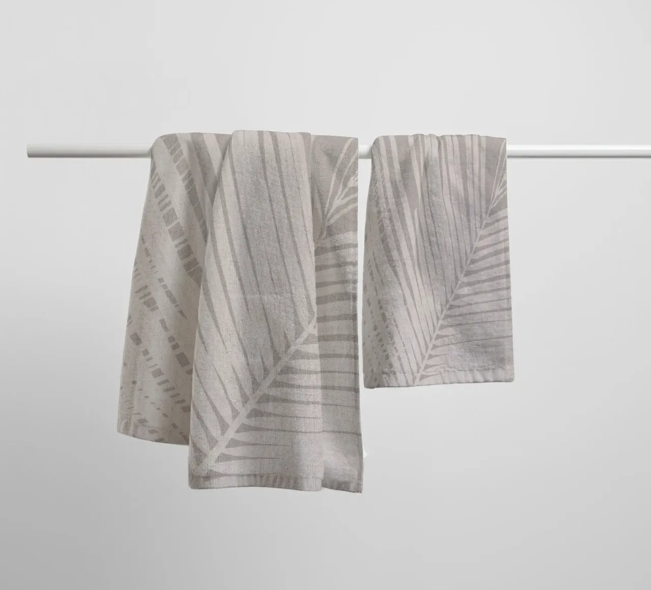 Neutral palm leaf on beige linen texture towel by Bloomery Decor