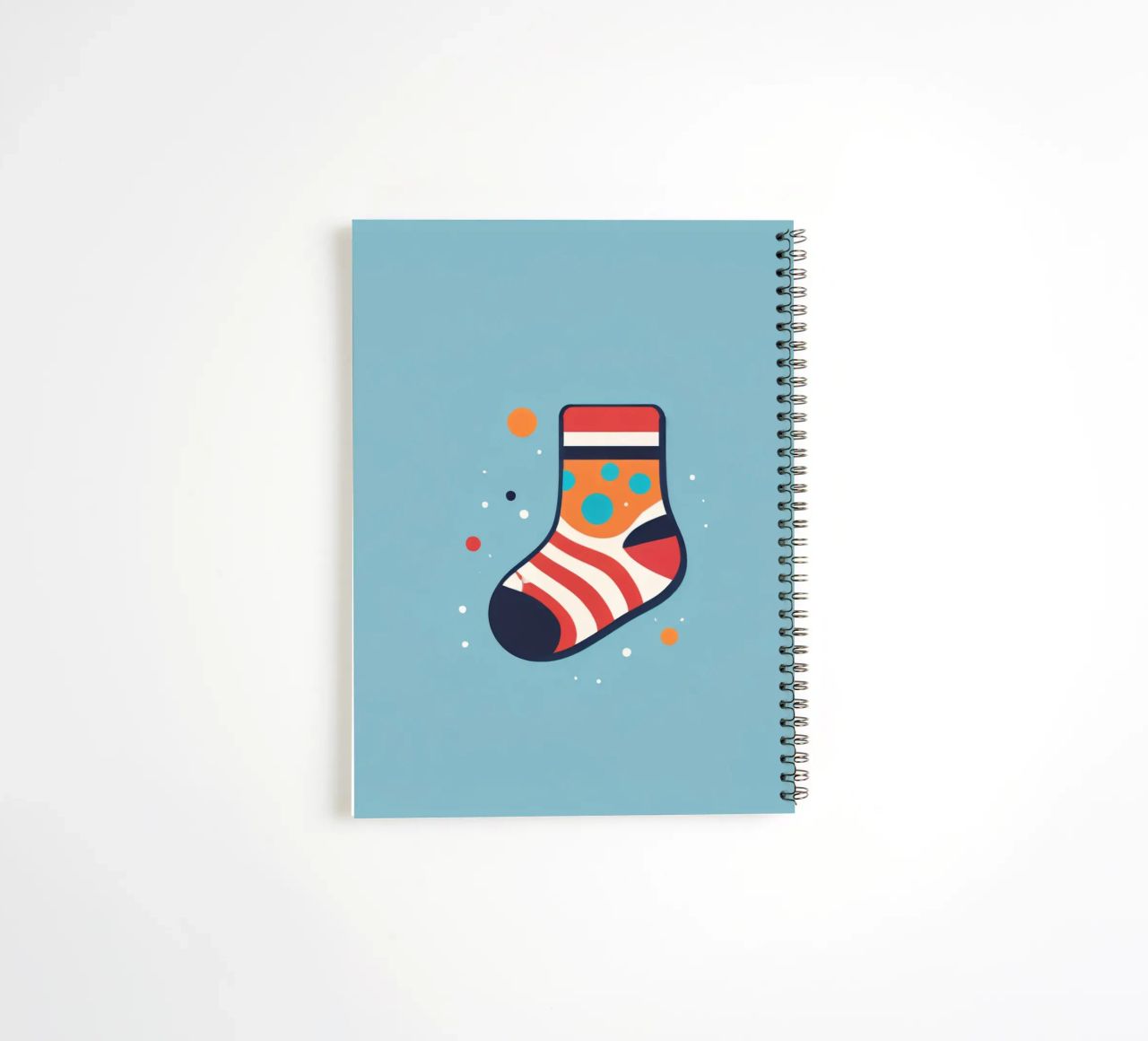 colorful sock with playful patterns on spiral notebook by DesignDoodle