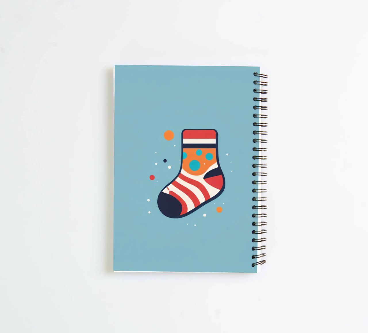 colorful sock with playful patterns on spiral notebook by DesignDoodle