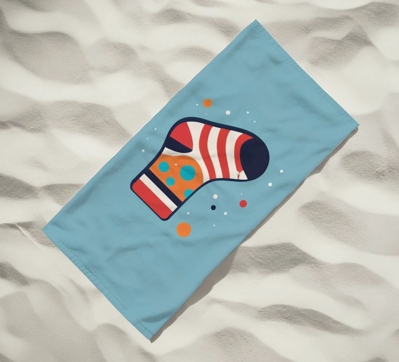 colorful sock with playful patterns on beach towel by DesignDoodle