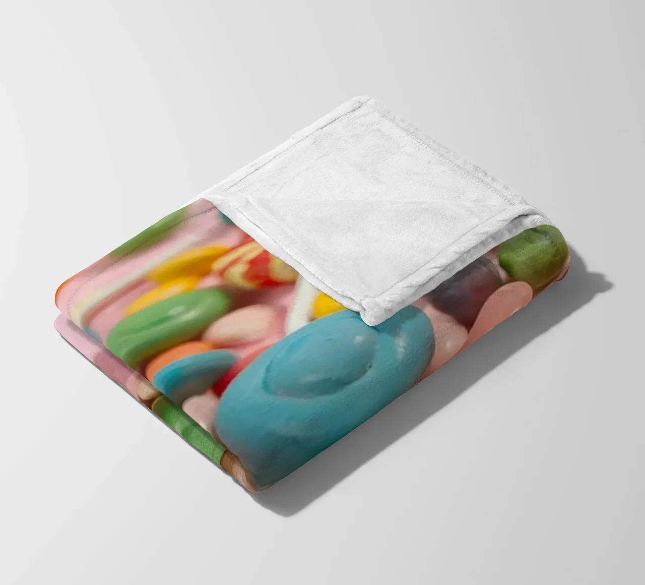 Assortimento di caramelle colorate sparse coperta in pile da DesignDoodle