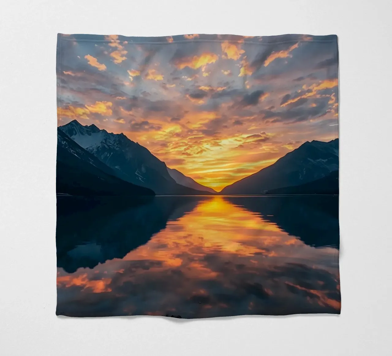 Sunset reflects on calm lake with mountains fleece blanket by DesignDoodle