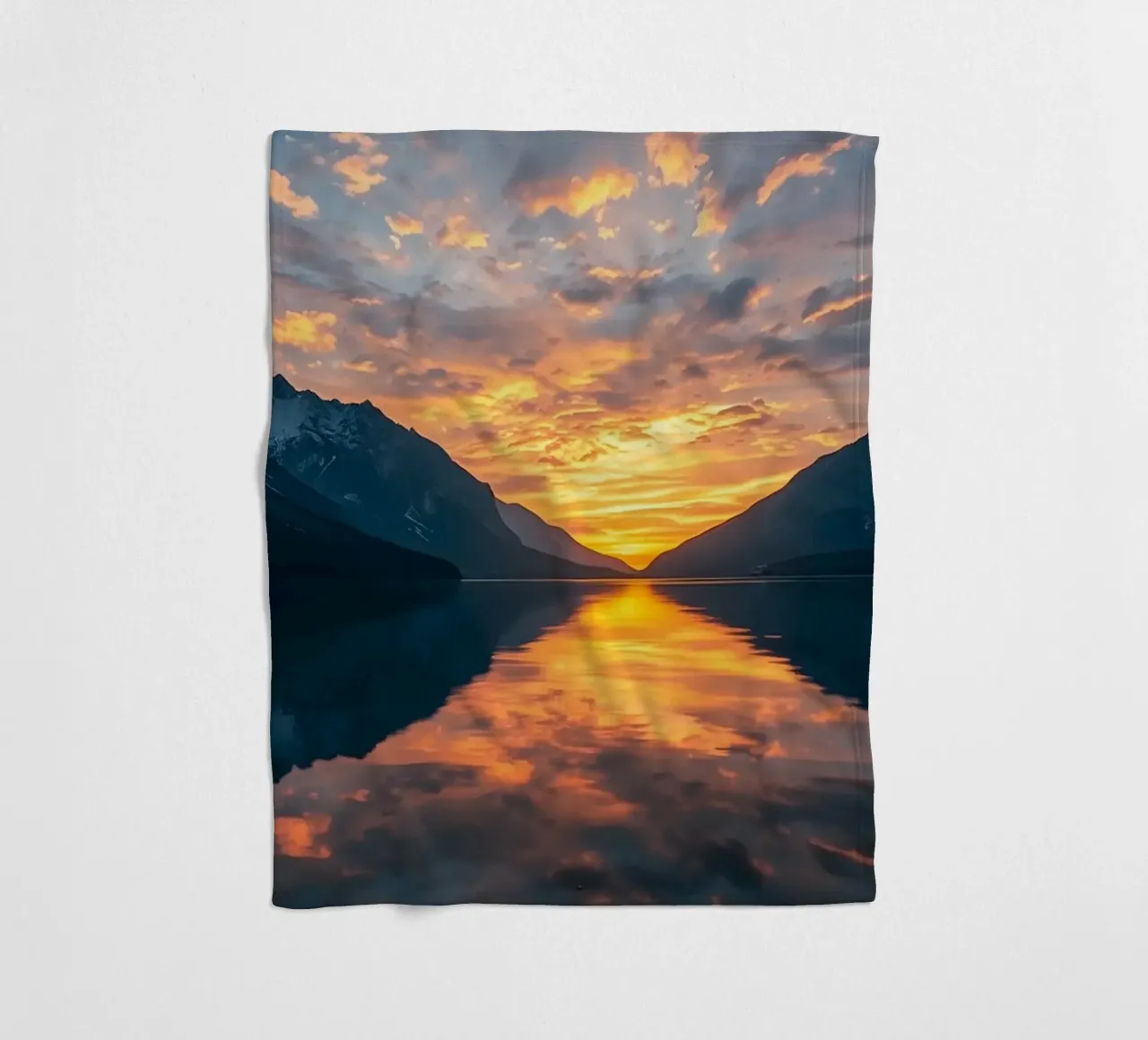 Sunset reflects on calm lake with mountains fleece blanket by DesignDoodle
