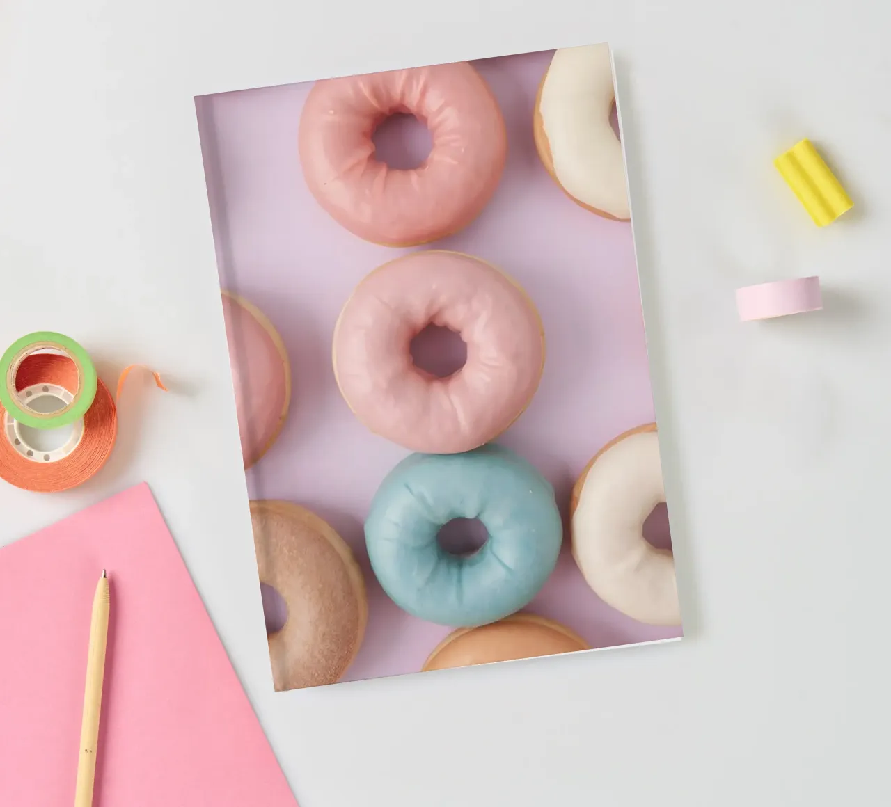 donuts arranged on a pastel background perfect for dessert l notebook by DesignDoodle