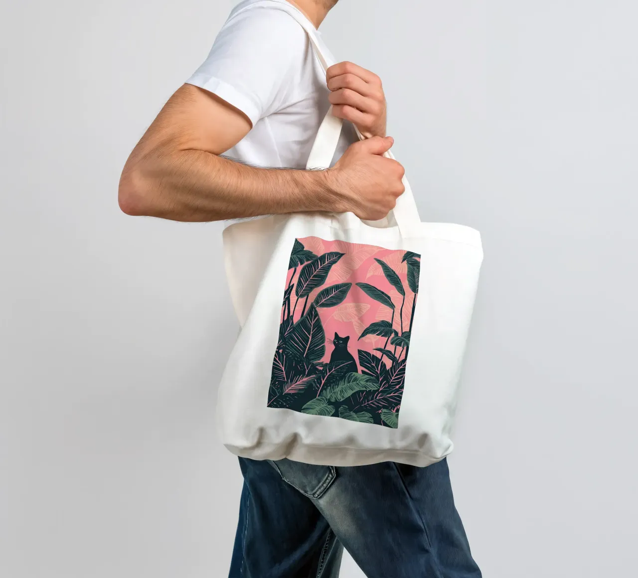 Gatto nero nella giungla di Calathea rosa e verde borsa in juta da Autofocus
