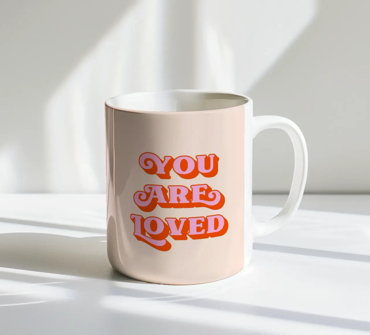 You are loved (Peach tone) ceramic mug by Paigaam Studio
