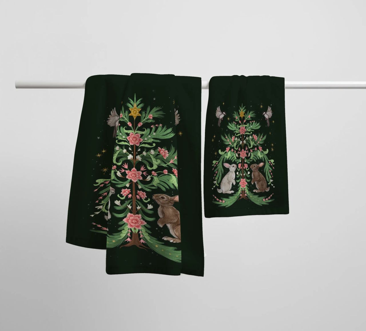 Yule Tree Rabbits towel by Laura Graves