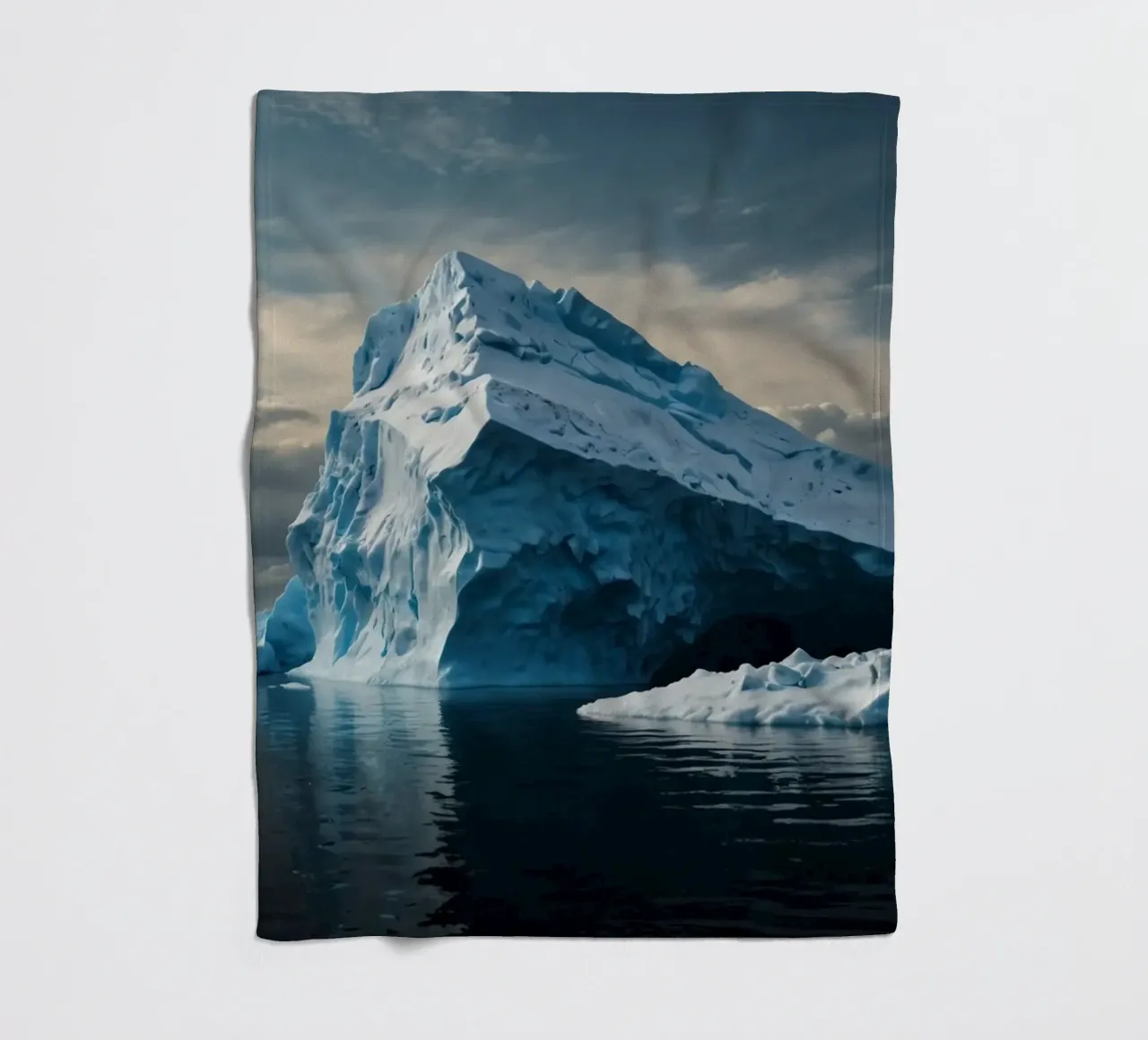 Impressive icebergs reflecting in tranquil waters fleece blanket by DesignDoodle