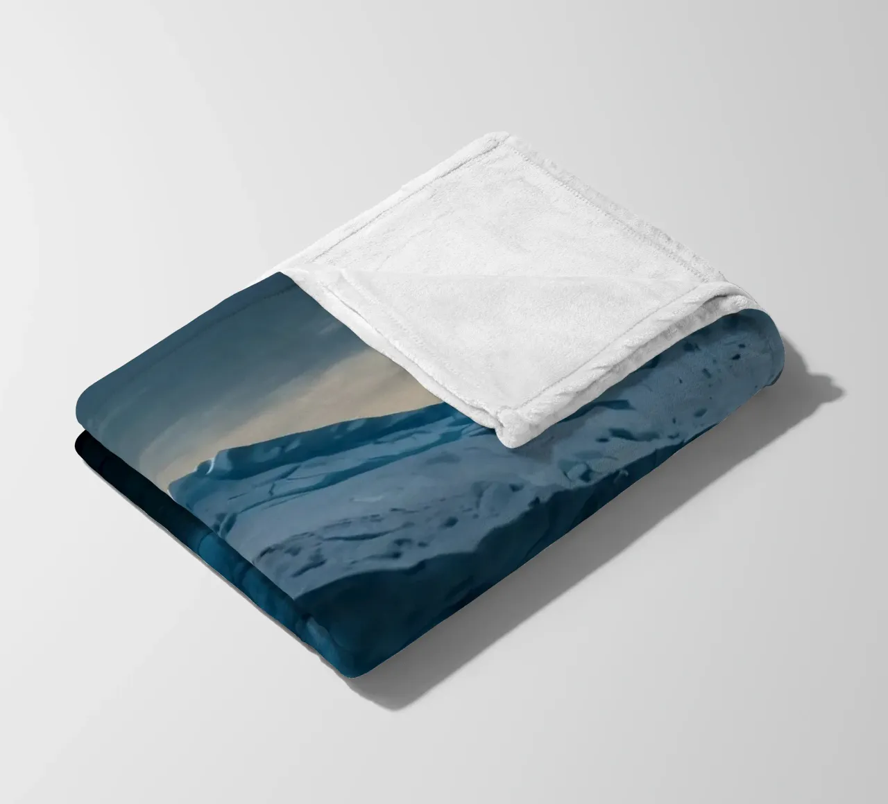Impressive icebergs reflecting in tranquil waters fleece blanket by DesignDoodle