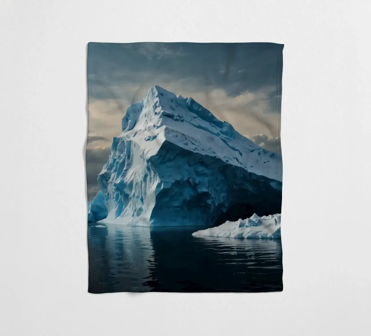 Impressive icebergs reflecting in tranquil waters fleece blanket by DesignDoodle