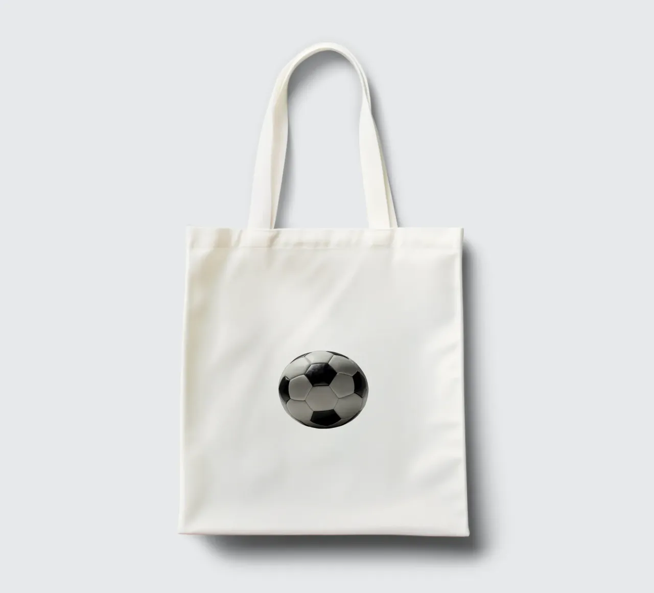 Pallone da calcio esposto su una superficie liscia con illuminazione soffusa borsa in juta da DesignDoodle