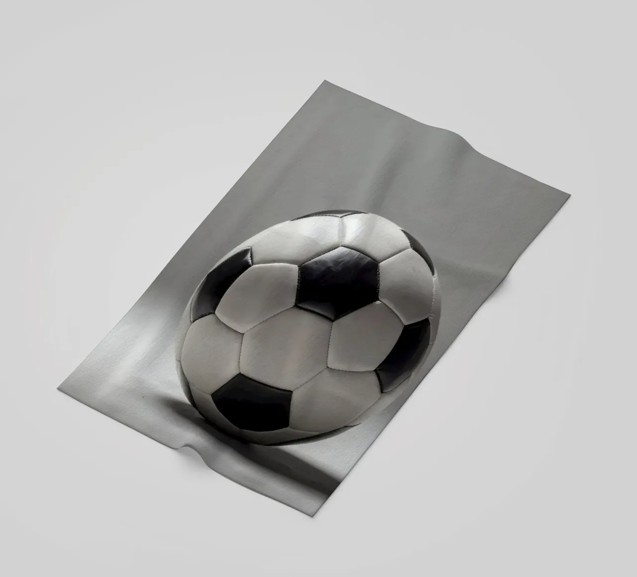 Soccer ball displayed on a plain surface with soft lighting beach towel by DesignDoodle
