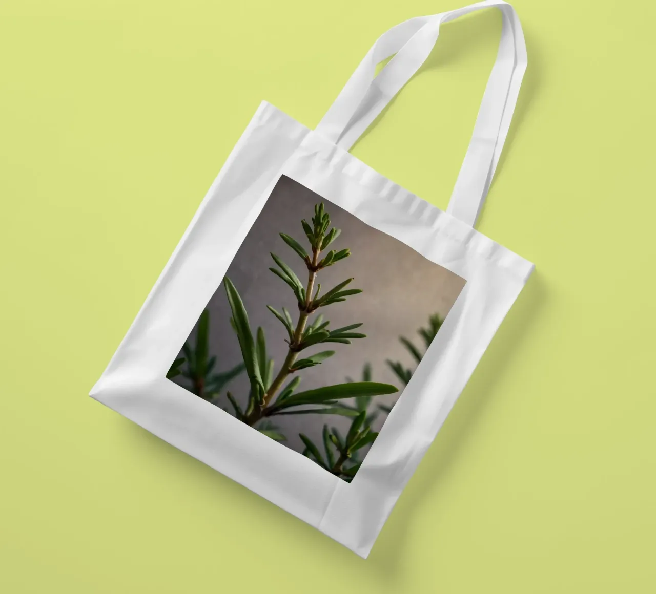 Green plant branches reach upward, showcasing vibrant leaves tote bag by DesignDoodle