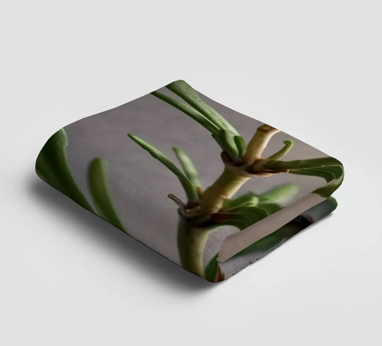 Green plant branches reach upward, showcasing vibrant leaves towel by DesignDoodle