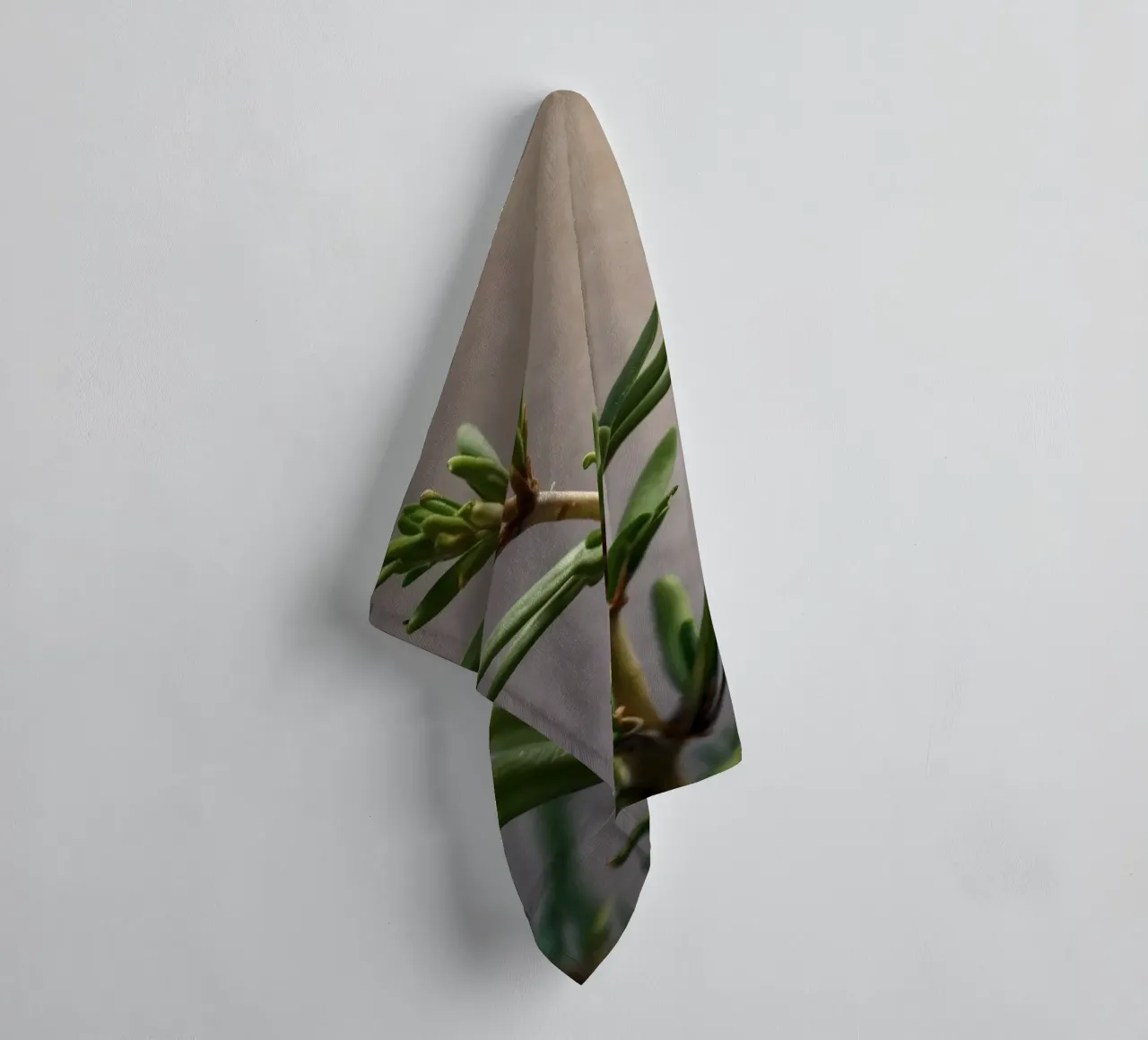 Green plant branches reach upward, showcasing vibrant leaves towel by DesignDoodle