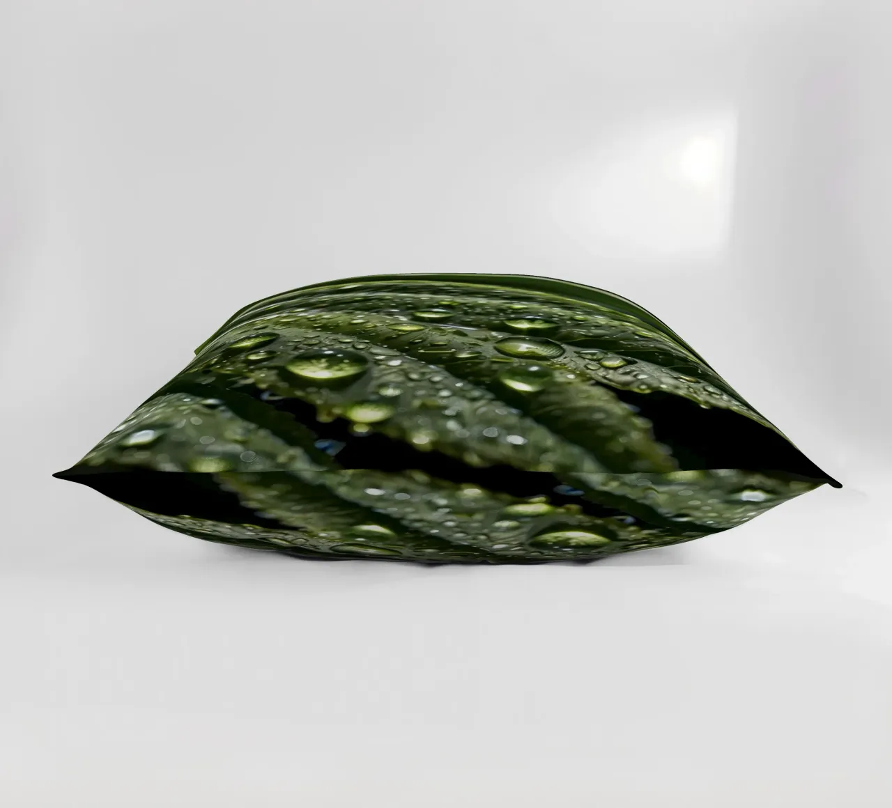 Close-up view of vibrant green leaves covered with dew dropl decorative cushion by DesignDoodle